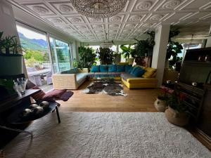 a living room with a couch and a table at Penthouse in Schaan in Schaan