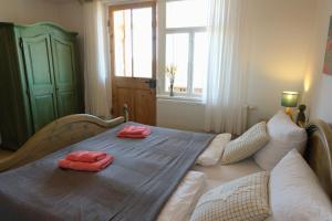 a bedroom with a bed with two towels on it at Villa Lydia in Kurort Altenberg +53 photos