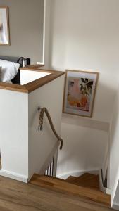 a stairwell with a snake crawling up the wall at Fichtennest in Sundern