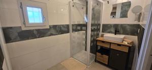 a bathroom with a shower and a sink at L eden Maison en Camargue in Salin-de-Giraud +18 photos