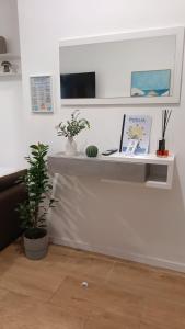 a room with a desk with a computer on it at Dolce Vita in Bari