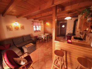 a living room with a couch and a table at Holiday Home Brist in Brestova Draga