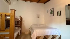 a bedroom with a bunk bed and a ladder at Casalajud Wellness in Taganga