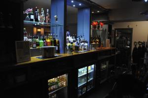 a bar with a lot of bottles of alcohol at The Sydney Arms in Dorchester