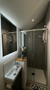 a bathroom with a sink and a shower at The Loft in Cookstown Junction