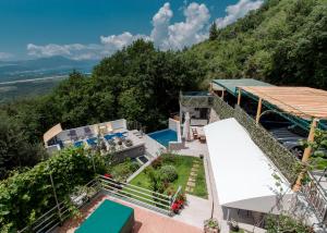 an aerial view of a house with a swimming pool at Apartment Panorama in Kotor