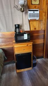 a microwave sitting on top of a wooden table at Toiyabe Motel in Walker +57 photos