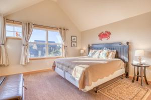 a bedroom with a bed and a window at A Mermaids Dream in Pacific City