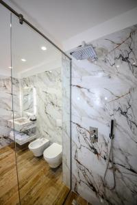 a bathroom with two toilets and a shower at Olive Farmhouse in Hamallë +109 photos