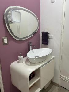 a bathroom with a white sink and a mirror at Cerca de todo en San Jerónimo in Monterrey