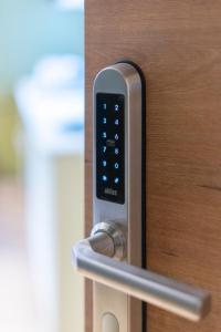 a close up of a door handle on a wooden door at La Encina Suites in Salamanca