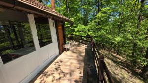 a porch of a house with a walkway at Forest House Bukulja in Arandelovac