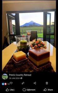 a table with several different types of cheeses on it at Peter Country Retreat in Midhirst