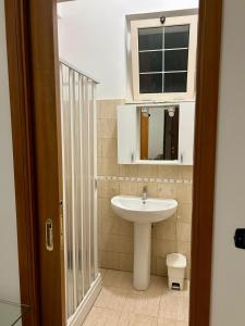 a bathroom with a sink and a mirror at diamond room in Palmi