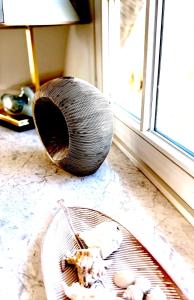 a glass bowl sitting on the floor next to a window at FeWo Findling Ruegen in Putbus
