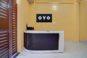 a tv sitting on a wall in a room at SPOT ON Galaxy Hotel in Lucknow