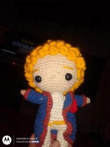 a crocheted doll with yellow hair and blue arms at Pinkanta in Las Compuertas
