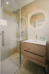 a bathroom with a sink and a shower at Villa d'Avó Dalva in Vila Chã +25 photos