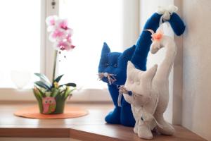 a group of stuffed animals sitting on a shelf at Casa vacanze Maria in Tesero +31 photos