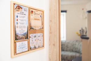 a bulletin board on a wall in a room at Casa vacanze Maria in Tesero