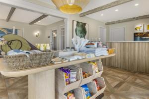a room with a counter with baskets of food at Best Western Plus Beach View Lodge Carlsbad in Carlsbad