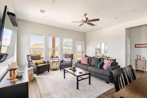 a living room with a couch and chairs and a table at King Bed, Beach Views, The Salt Surf Shack in Bolivar Peninsula