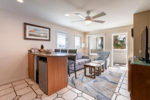 a kitchen and living room with a couch and a table at San Clemente Cove Resort in San Clemente