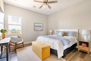 a bedroom with a bed and a ceiling fan at King Bed, Beach Views, The Salt Surf Shack in Bolivar Peninsula