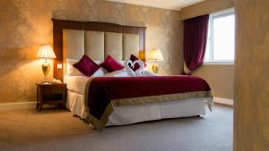 Postel nebo postele na pokoji v ubytování Talbot Hotel Clonmel