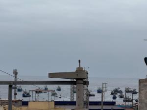 a view of a harbor with boats in the water at HOTEL SANTA BARBARA PUERTO ilo in Ilo