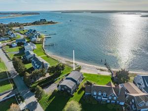 an aerial view of a beach with houses and the water at Cape Cod Waterfront with Stunning Views in Buzzards Bay