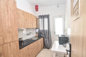 a kitchen with a sink and a counter top at Ikaria Therma Blue in Agios Kirykos