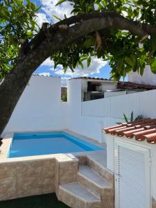 a swimming pool in the backyard of a house at A Casa Azul in Vaiamonte