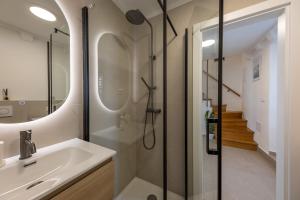 a bathroom with a shower and a sink at Whispering Views House Old Town in Dubrovnik