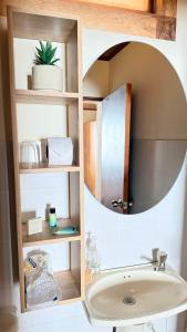 a bathroom with a mirror and a sink at Hotel Boutique Villa Mercedes in Sopó +60 photos