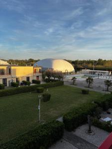 a large building with a large dome in a park at La casa di Giorè - Fronte Mare Gabbiani Ombrellone e 2 lettini inclusi in Fano
