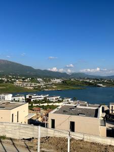a view of a city with a body of water at Sunlake Villa in Tirana