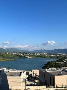 a view of a large body of water with buildings at Sunlake Villa in Tirana