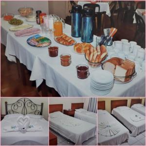 a white table with plates of food on it at Ibiza Hostel Suites in Santa Cruz de la Sierra