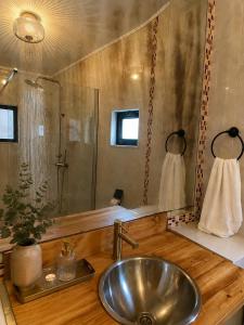 a bathroom with a sink and a mirror at Refúgio No16 Ocean Air & Rooftop Flair in Albufeira