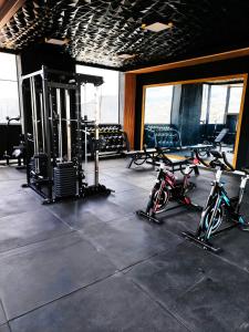 a gym with two bikes parked in a room at Golden in Cochabamba