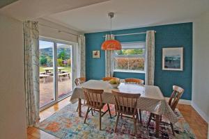 a dining room with a table and chairs and a window at 4 Bed in Beara oc-i437 in Adrigole