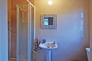 a bathroom with a sink and a shower at 4 Bed in Beara oc-i437 in Adrigole +19 photos