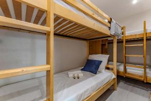 a couple of bunk beds in a room at Spacious Ski-In Out apartment with Mountain Views in Val Thorens +2 photos