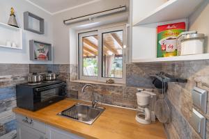a kitchen with a sink and a counter top at Artemis Boutique House in Artemida +50 photos