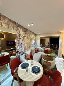 a living room with a couch and a table at Arena Maarif 41 in Maarif