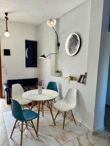 a dining room with a table and chairs at Creta Star Apartments in Agia Galini