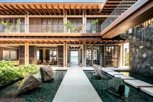 an external view of a house with a garden at Rosewood Mayakoba in Playa del Carmen