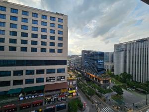 an aerial view of a city with tall buildings at 인터시티365호텔 in Seoul