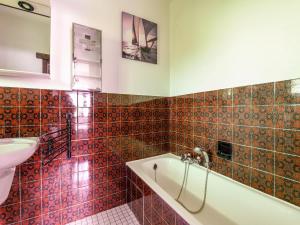 a bathroom with a tub and a sink at Floribert in Nieuwpoort-Bad +20 photos